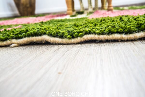 green berber rug with a beautiful Pink touch