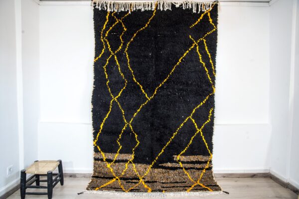 black moroccan rug decorated with modern golden lines for living room